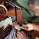 A child is given an injection as part of a malaria vaccine trial at a clinic in the Kenya